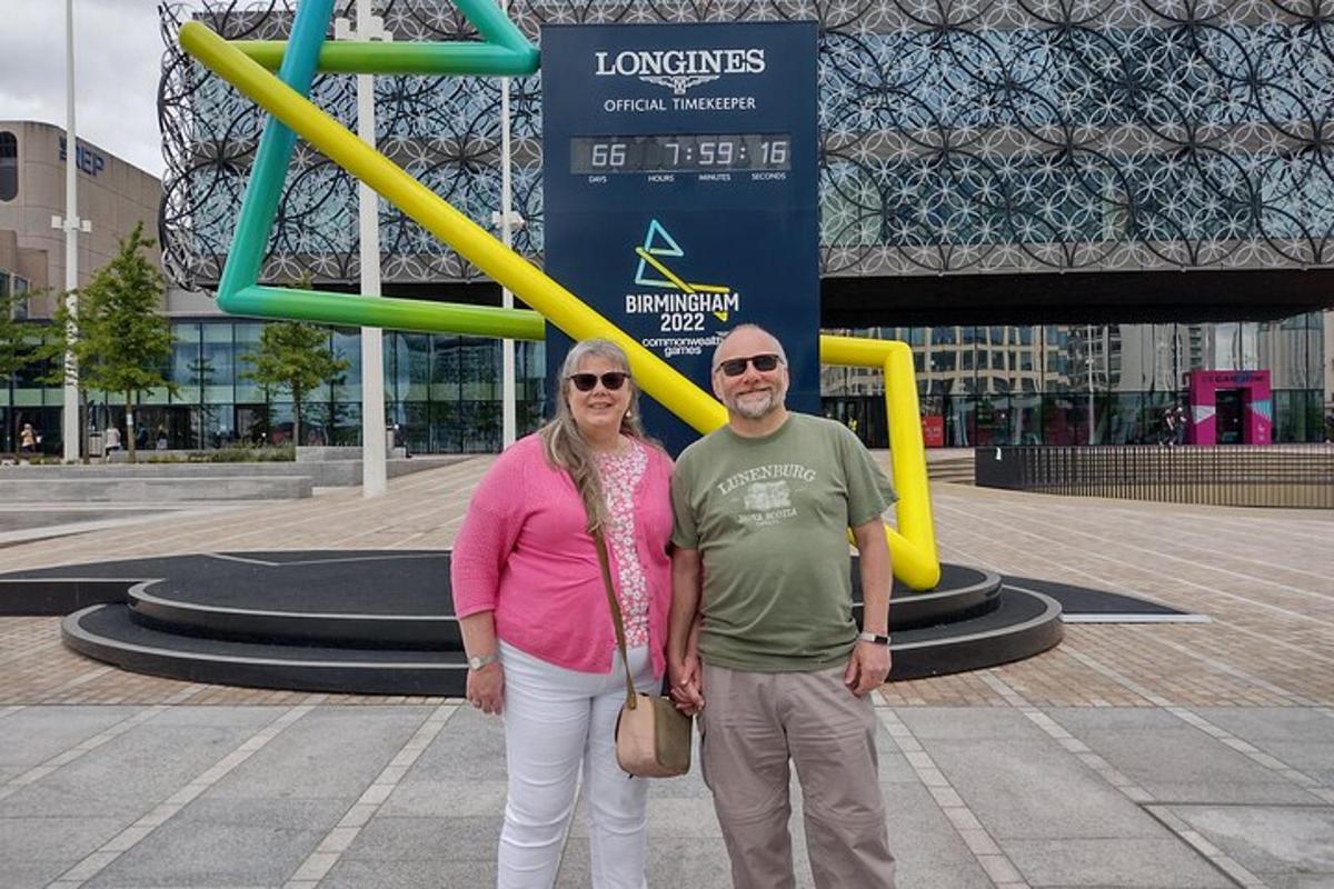 a man and woman standing in front of a playground