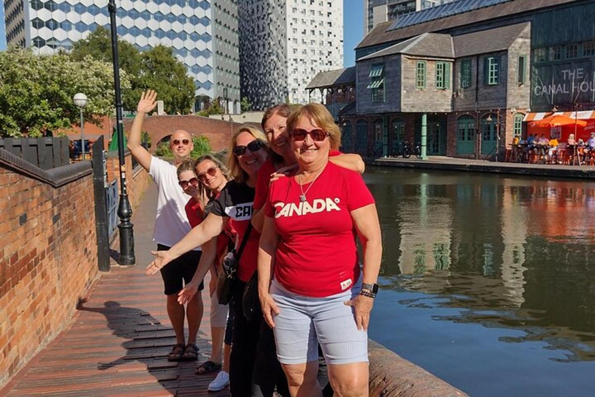 a group of people standing next to a body of water