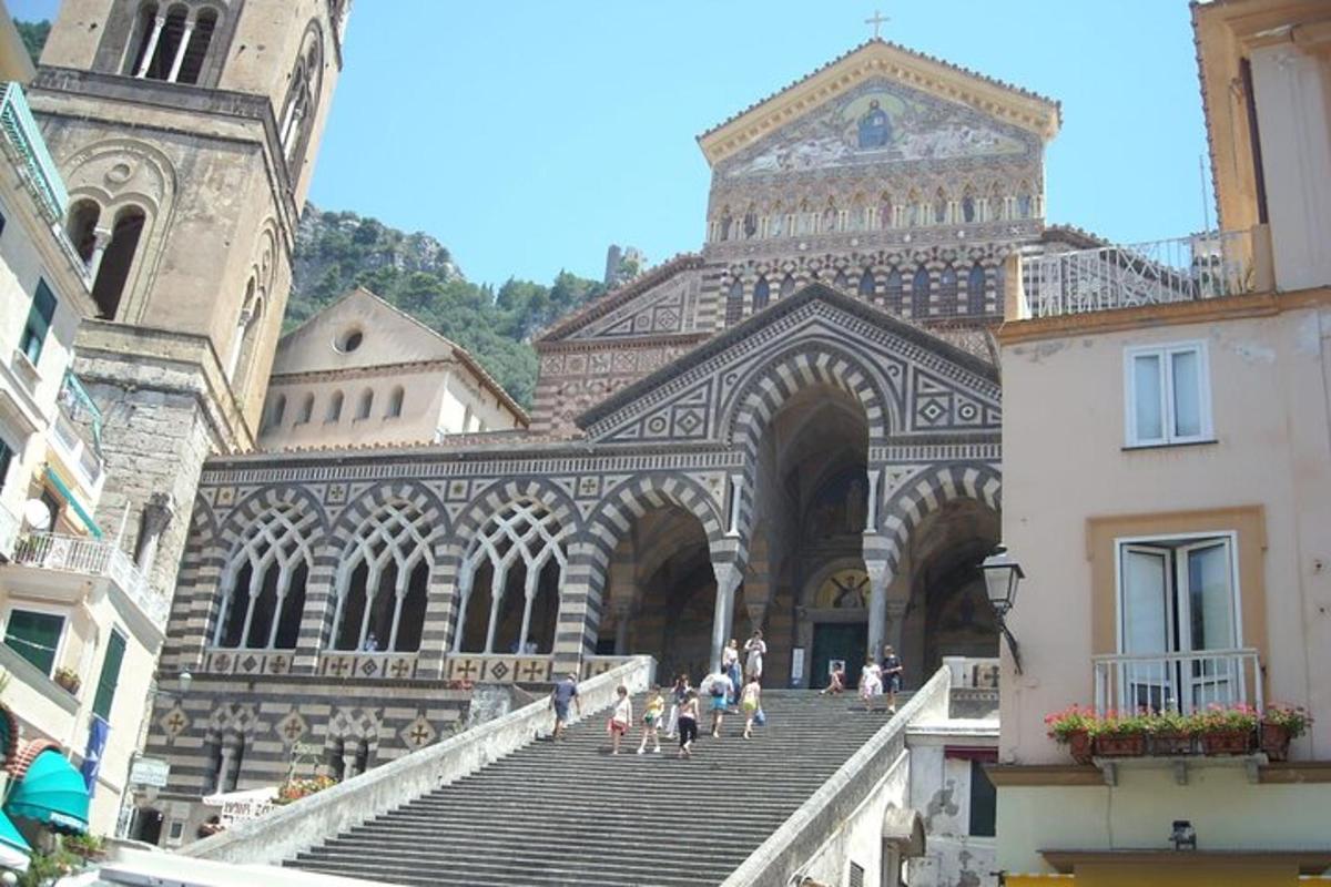 a group of people walking down the stairs of a building