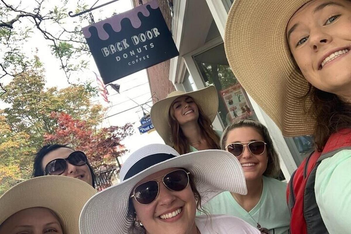 a group of women wearing hats posing for a picture