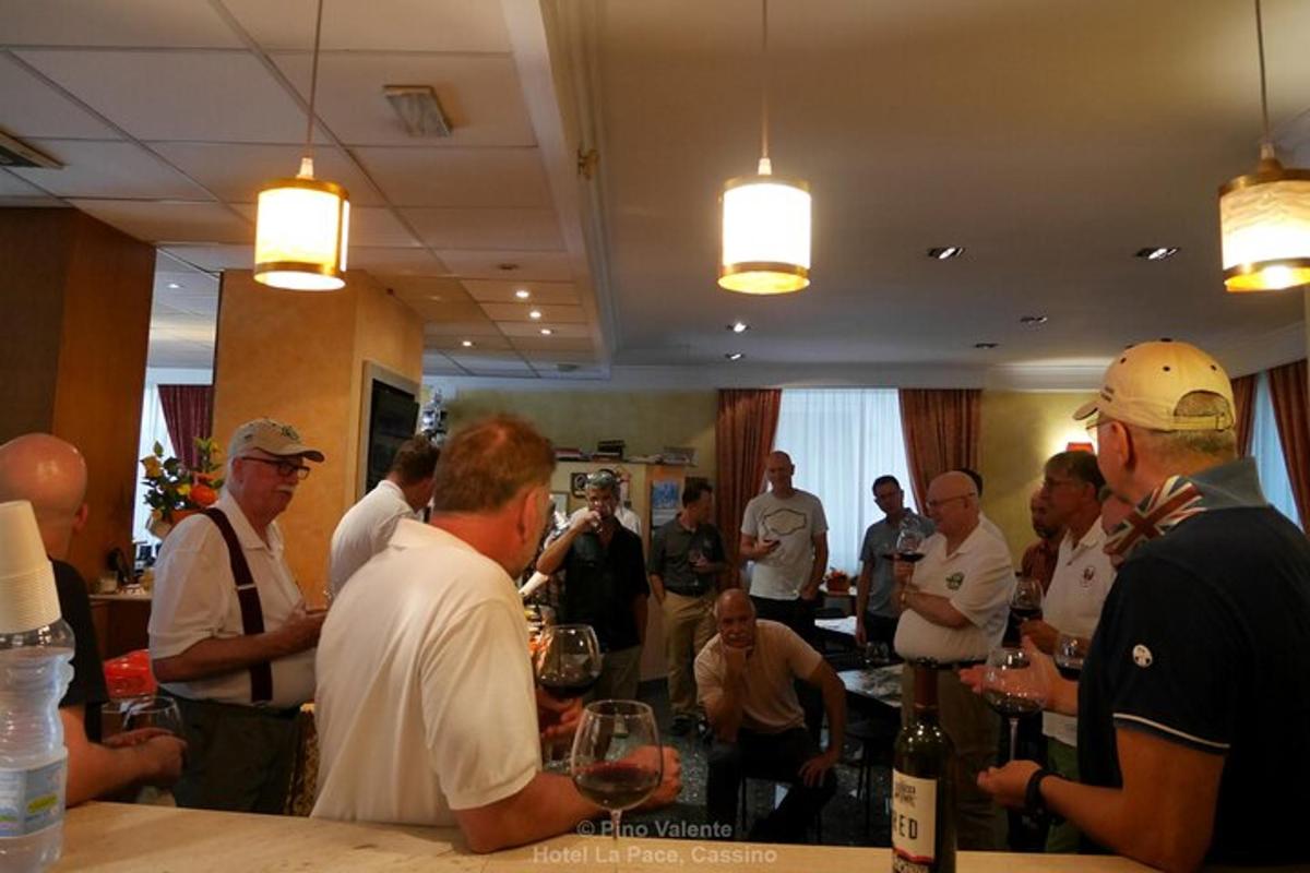 a group of people standing around a bar in a restaurant