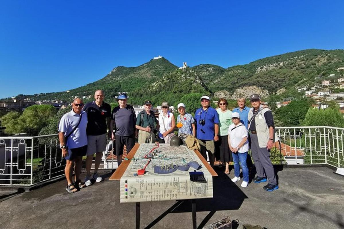 a group of people standing around a table on a roof