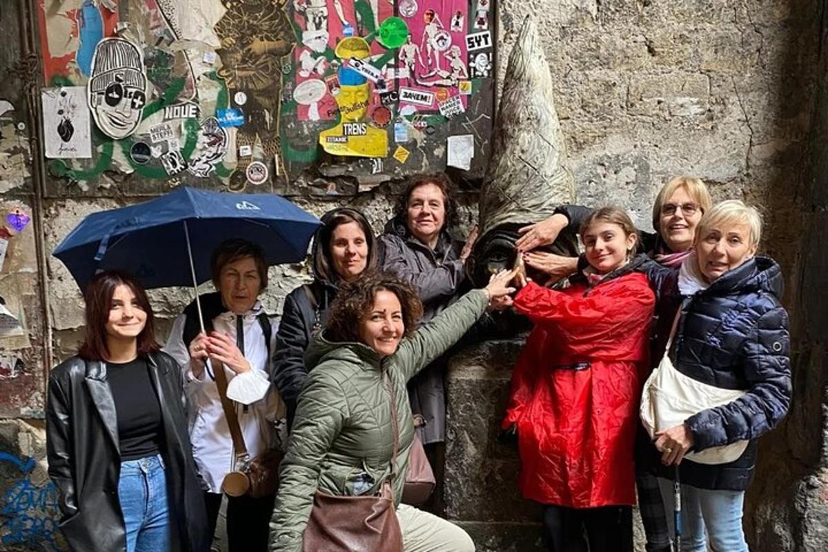 a group of people standing in front of a wall