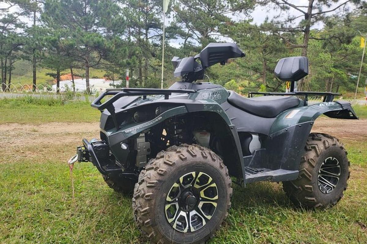 a four wheeler parked in a field of grass