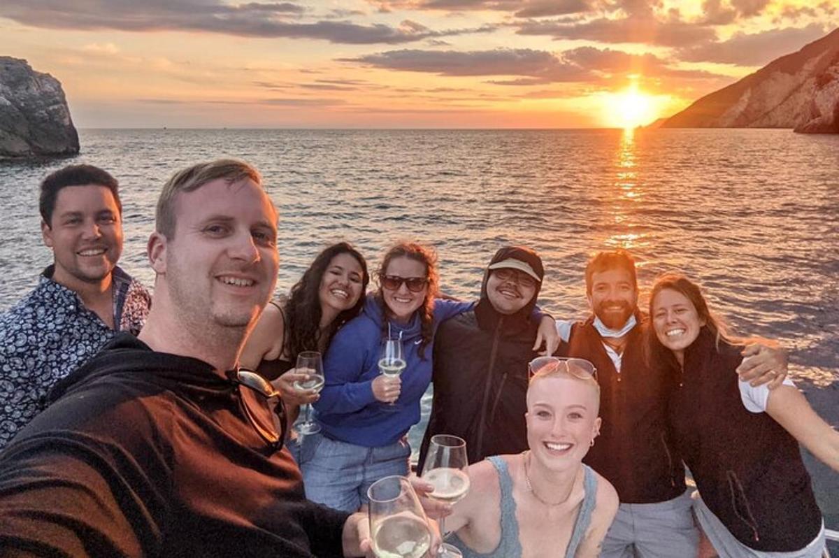a group of people on a boat with wine glasses