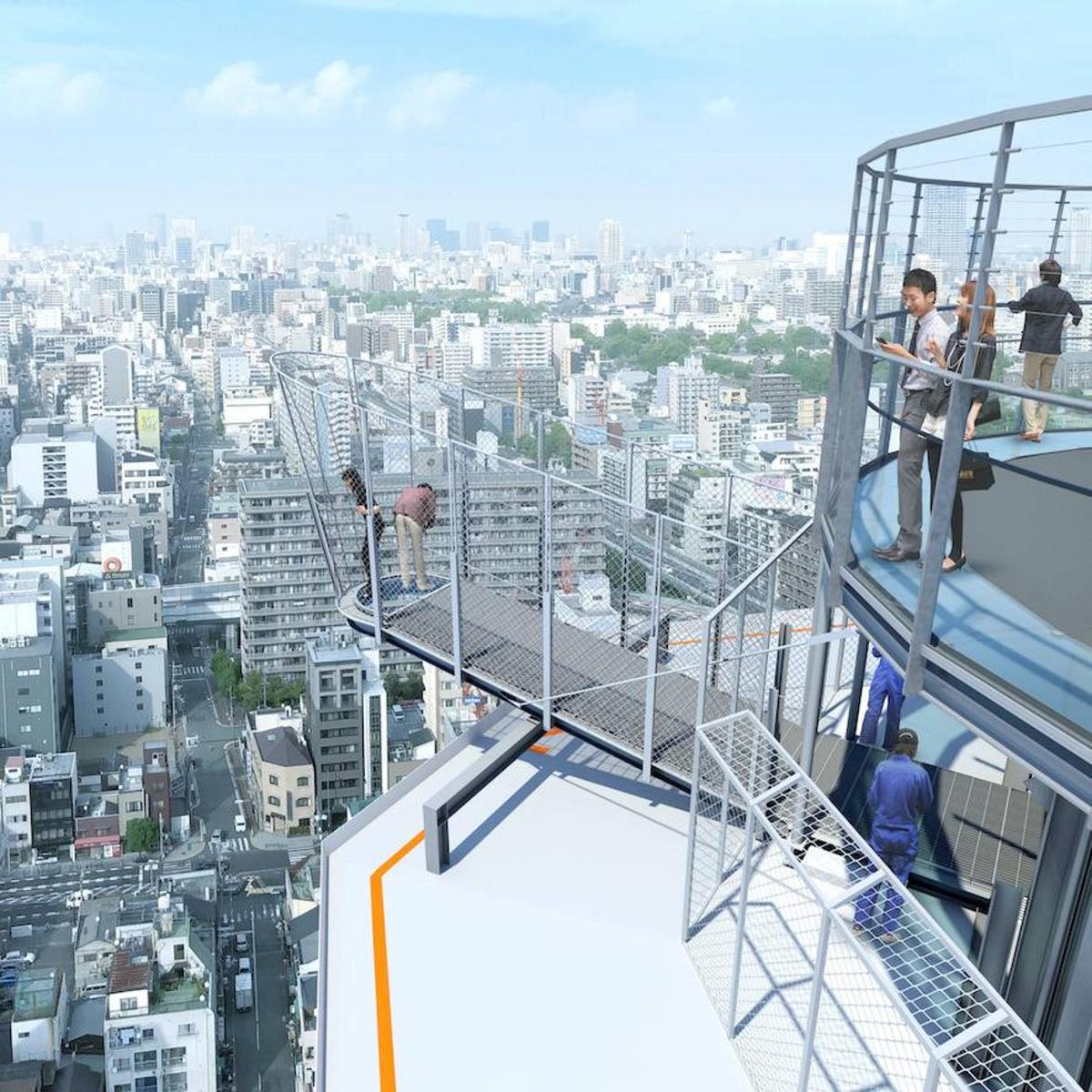 a group of people standing on the top of an observation tower