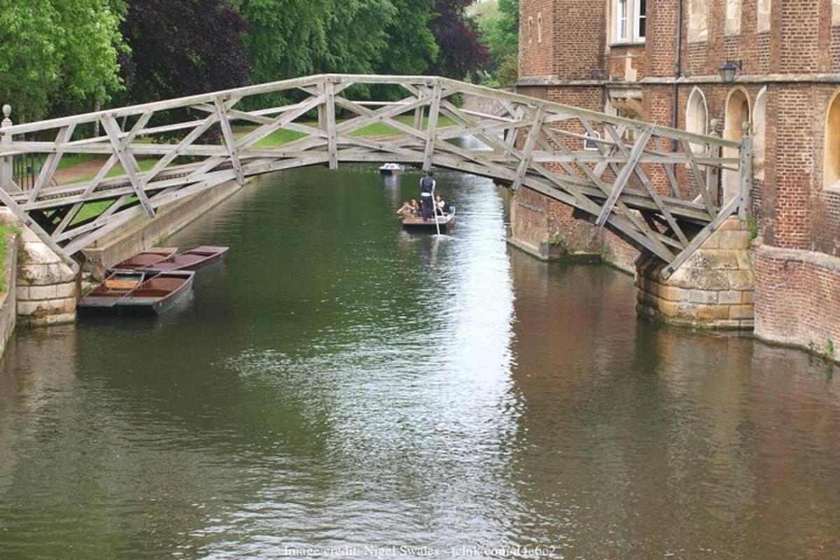 a boat in a river under a bridge