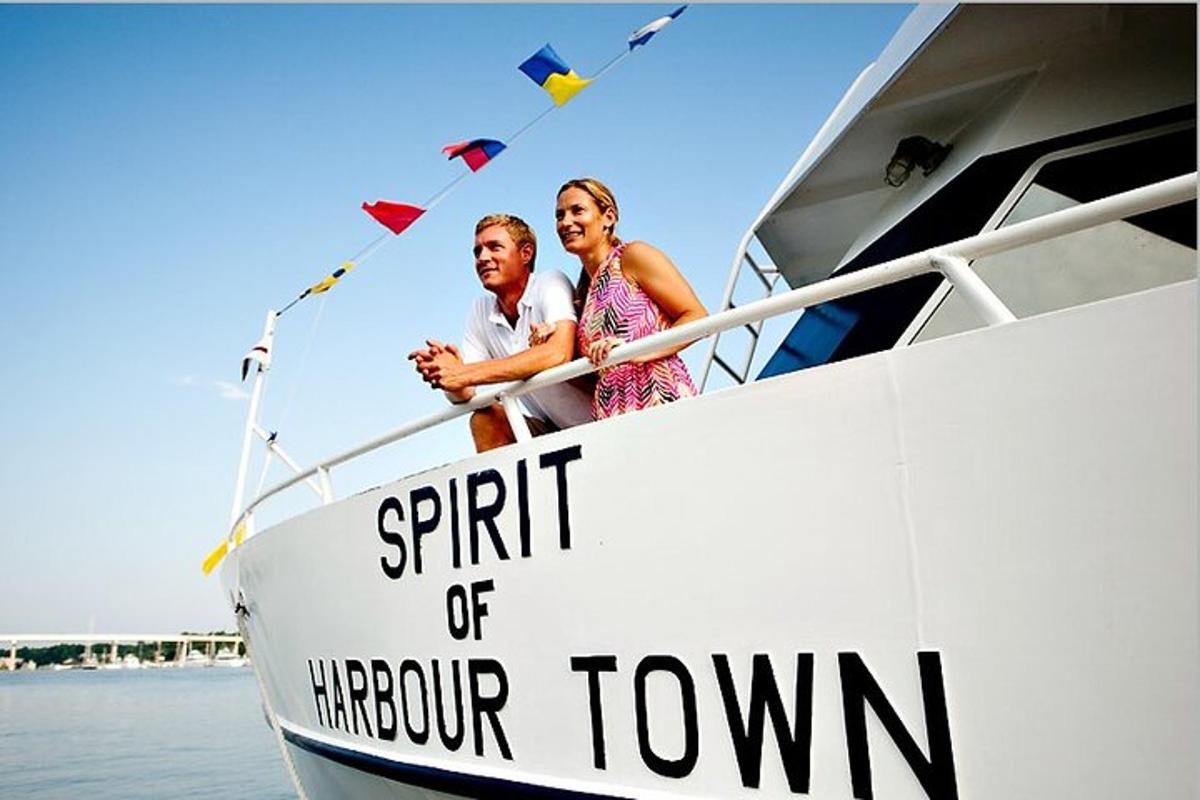 a man and woman on a boat in the water