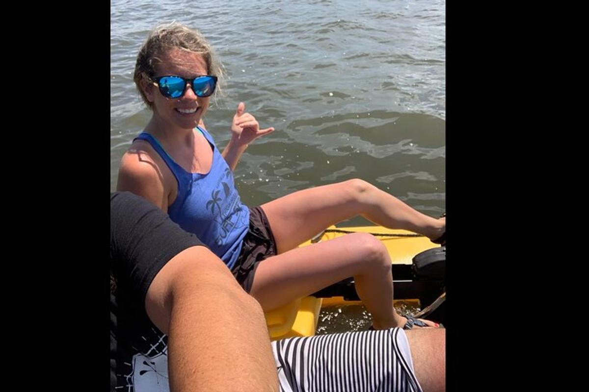 a woman sitting on a boat in the water