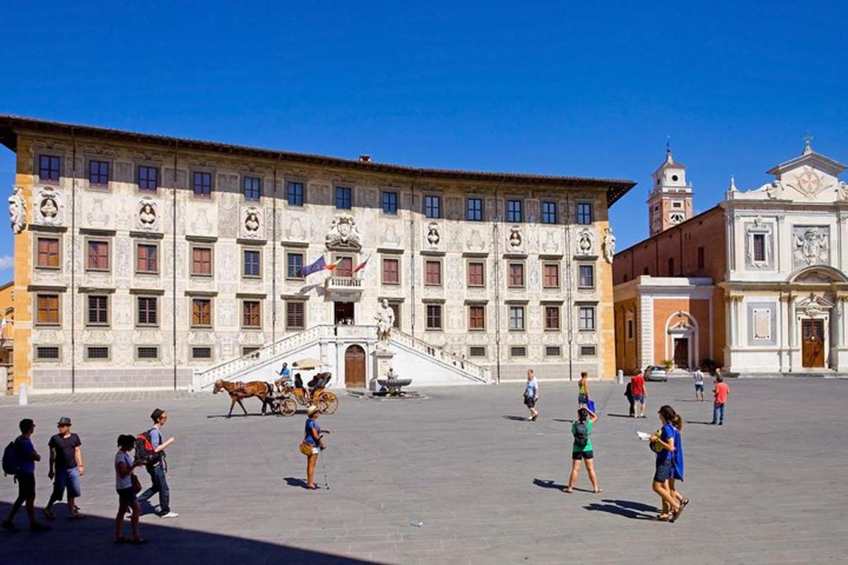 a group of people standing in front of a large building
