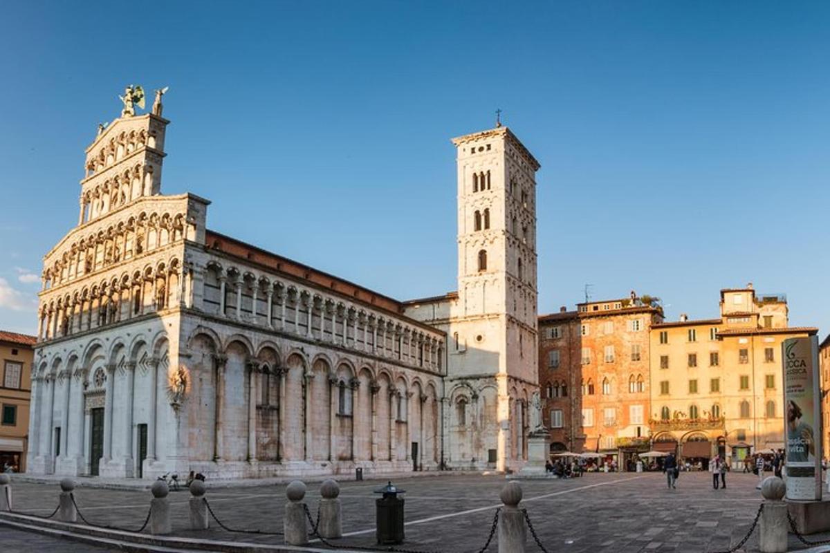 a large building with a clock tower in a city