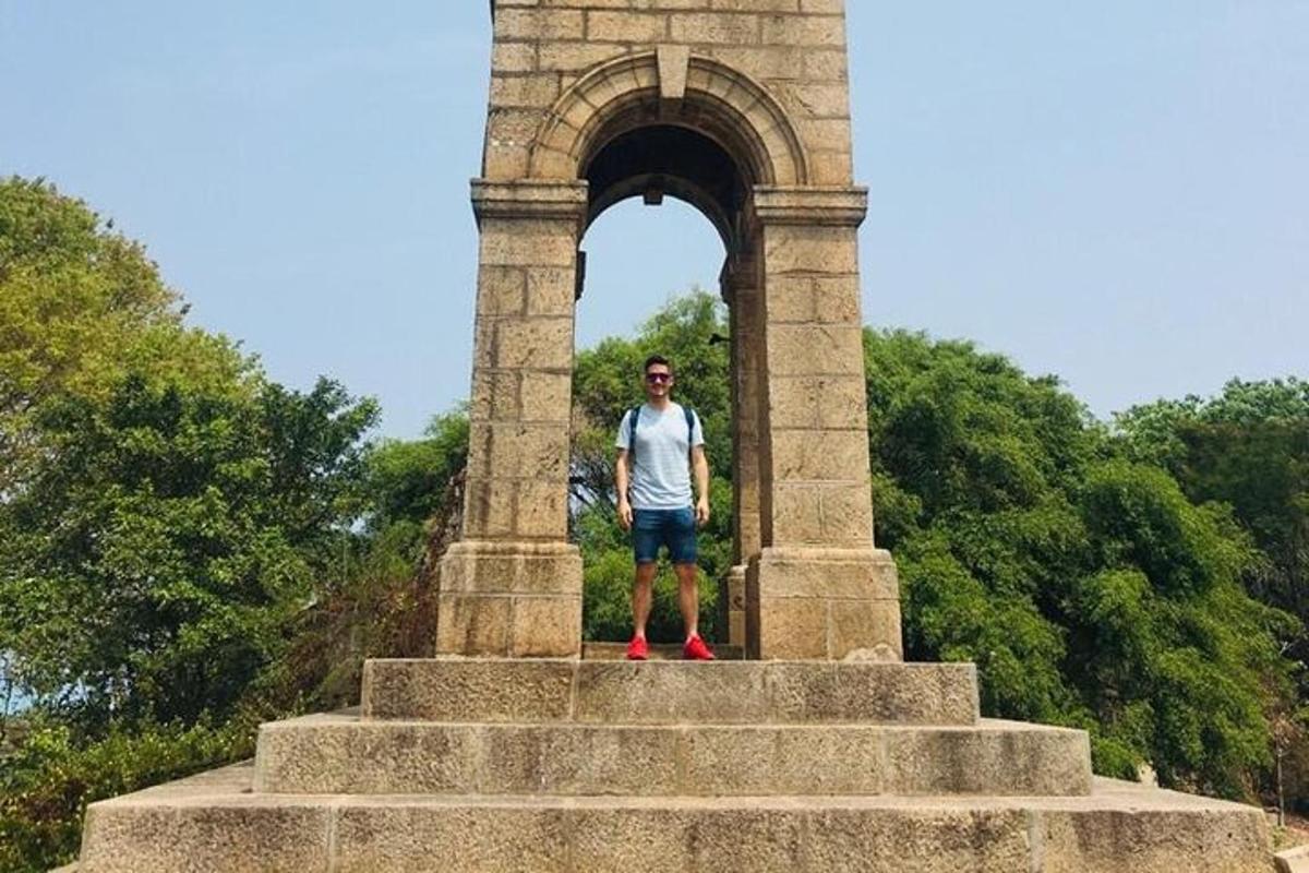 a man standing on the steps of a tower