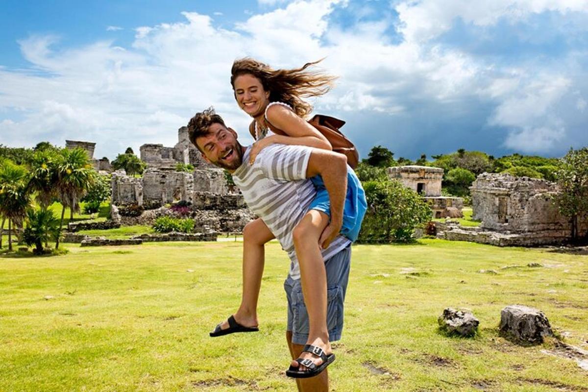 a man carrying a woman on his back while standing on a skateboard