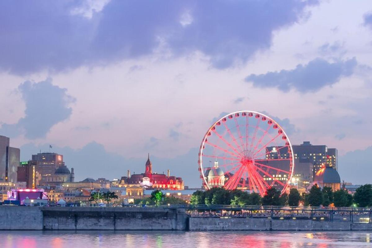a ferris wheel in front of a city at night