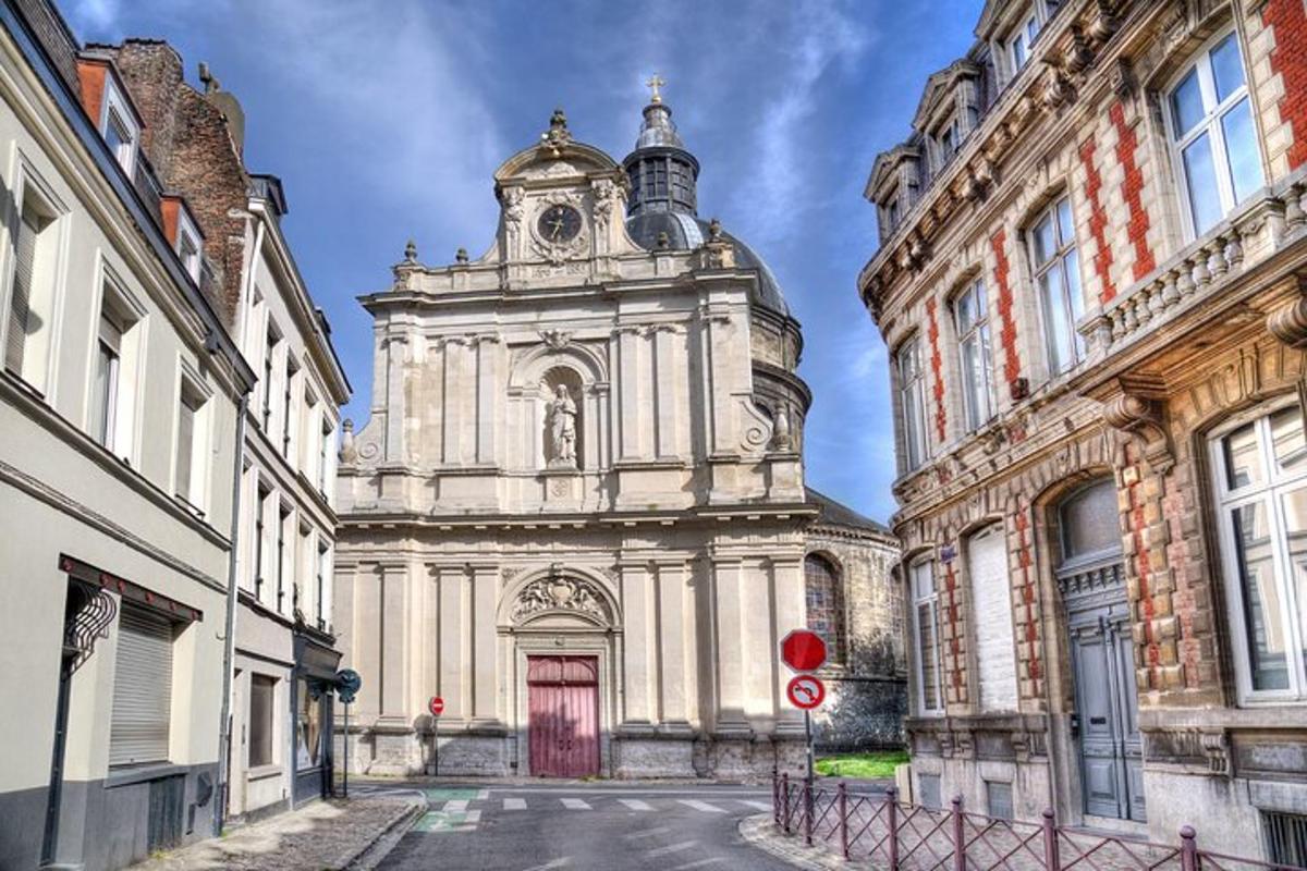 an old building with a tower with a red door