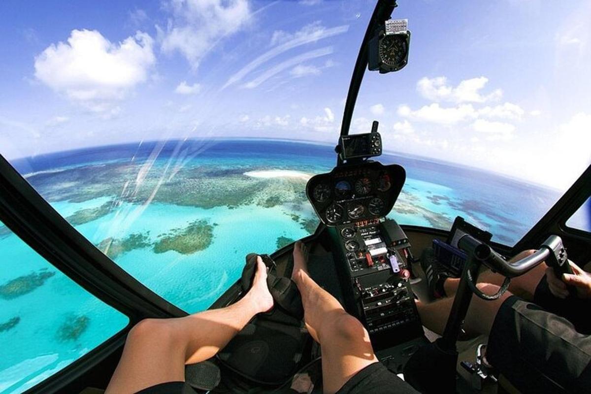 a group of people flying a plane over the ocean