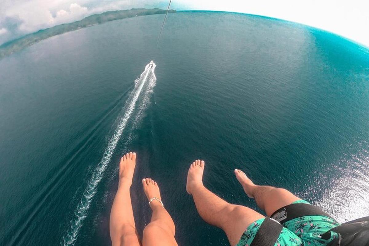 two people laying on a boat in the water