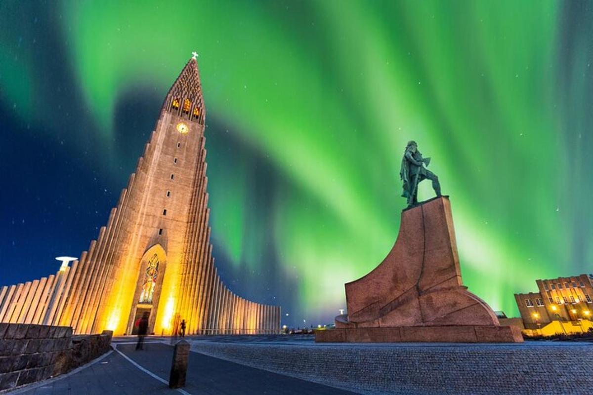 a statue in front of a building with a green sky