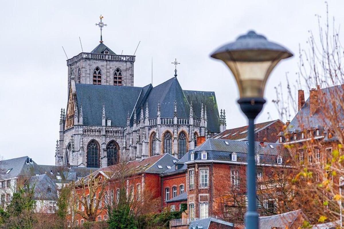 a large church with a tall tower and a street light