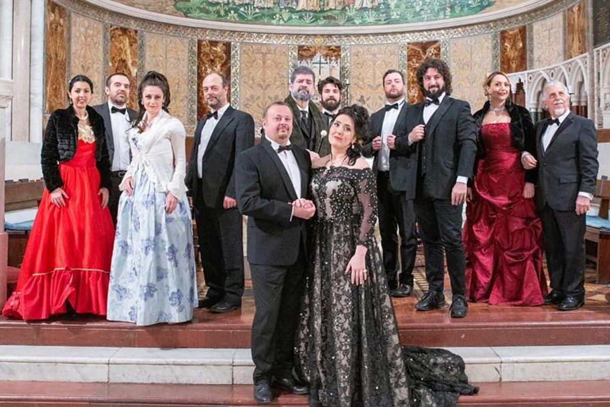 a group of people posing for a picture at a wedding