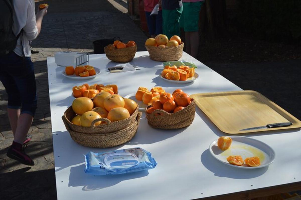 a table with baskets of fruit on top of it