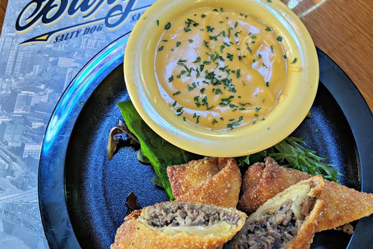a plate of food with a bowl of soup and bread
