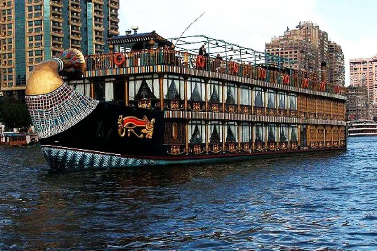 a large boat in the water next to some buildings