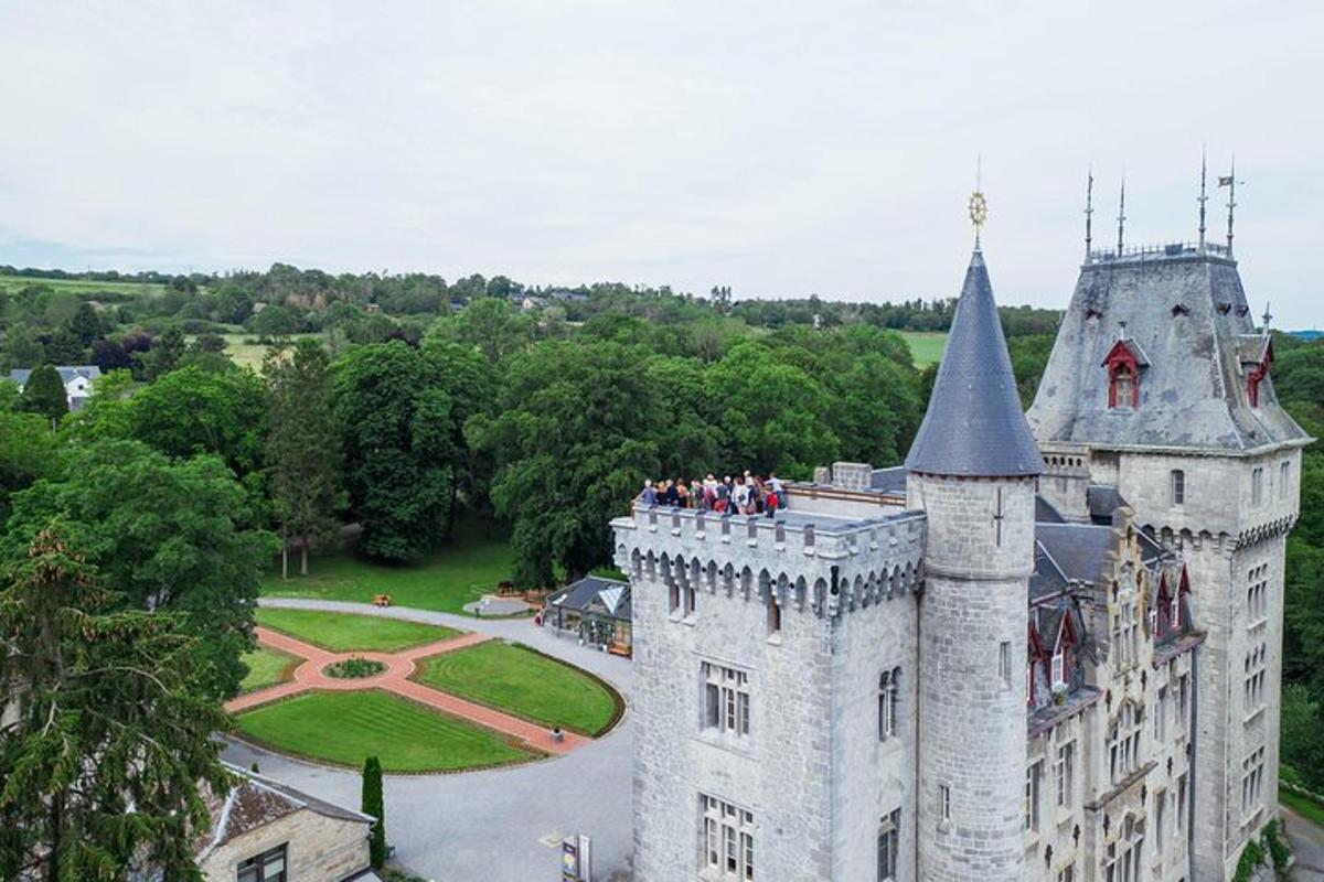 a group of people standing on top of a castle