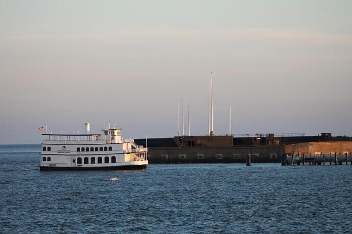 a large boat in the water near a dock