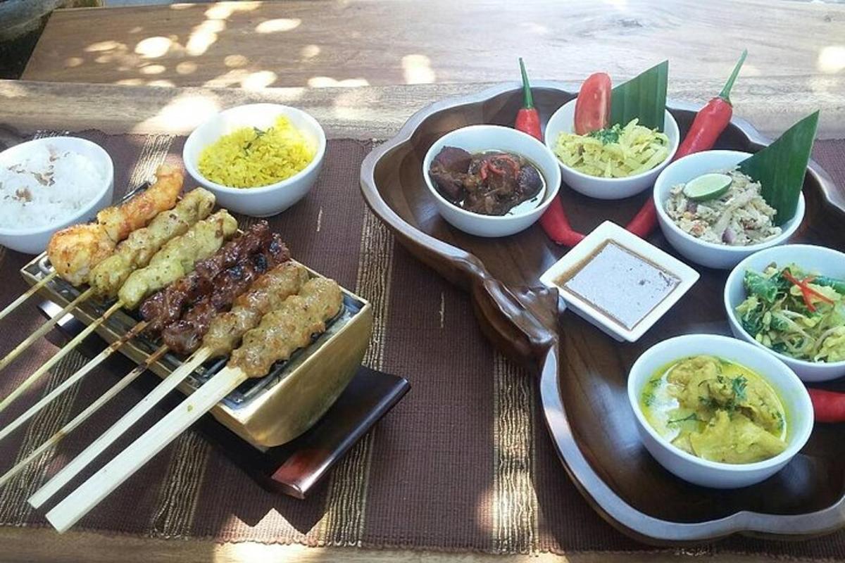 a tray of food with chopsticks and bowls of food