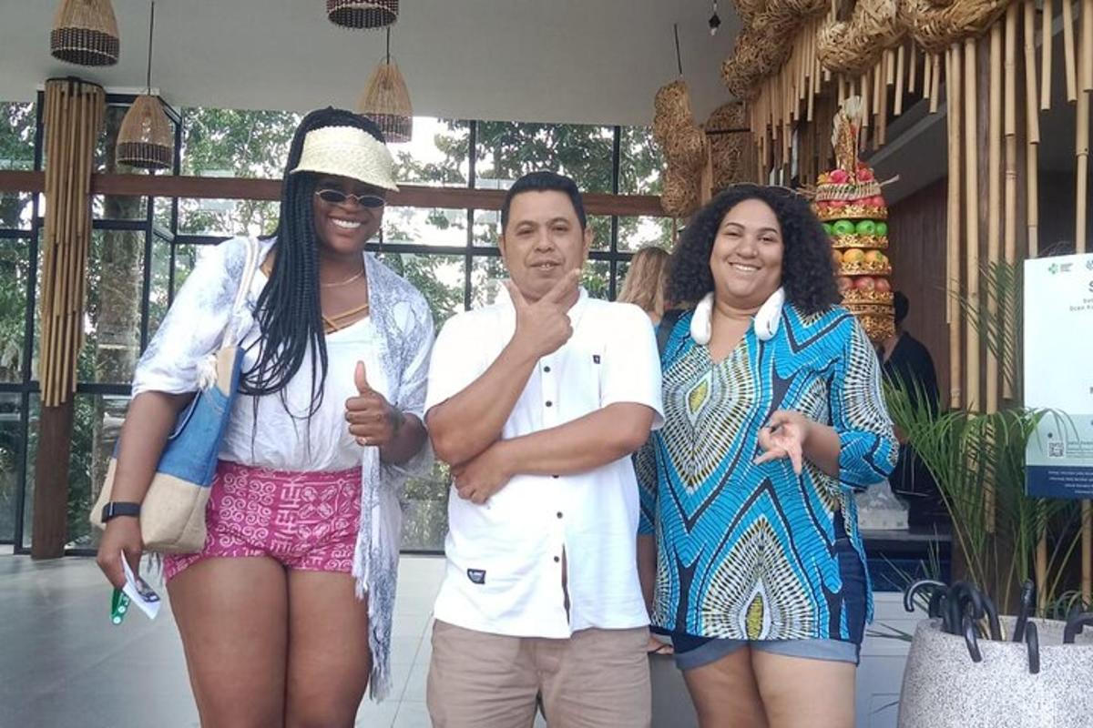 two women and a man posing for a picture