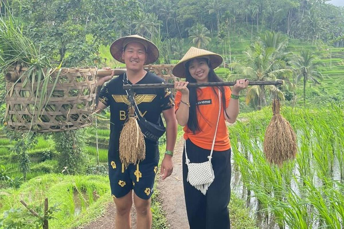 a man and a woman walking down a dirt road