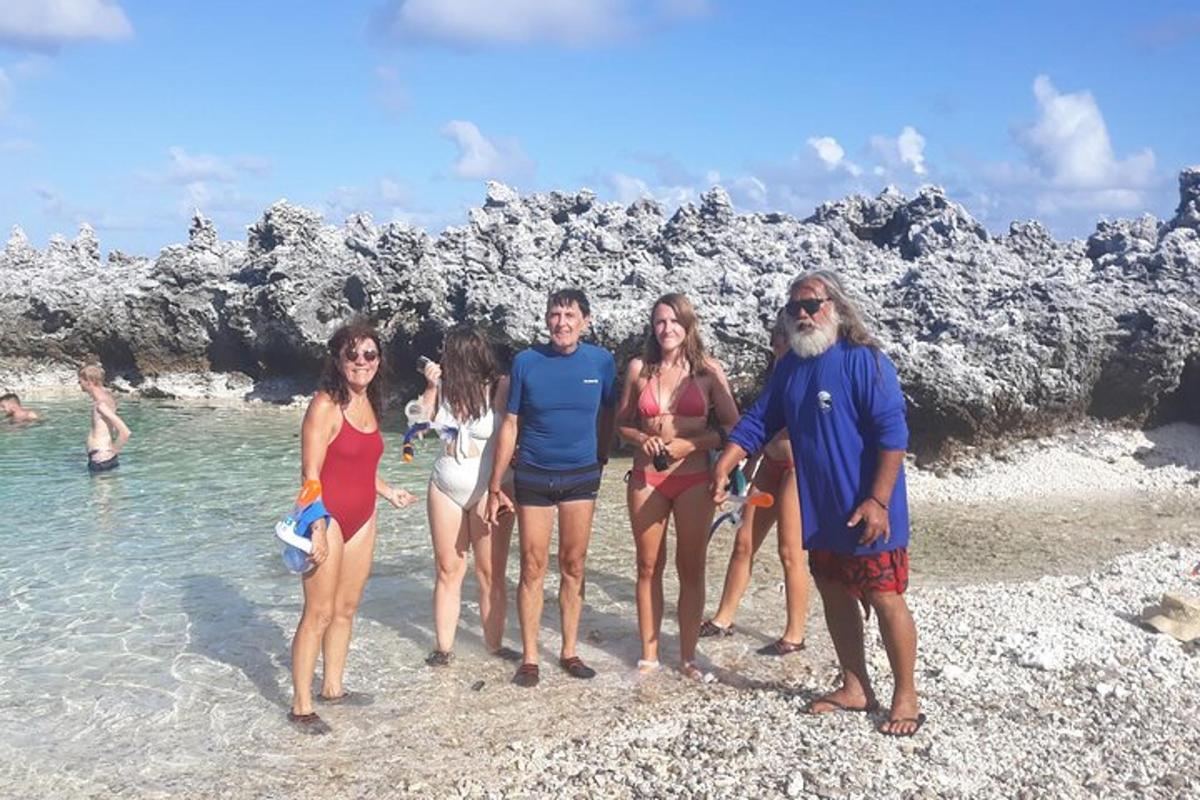 a group of people standing on a beach