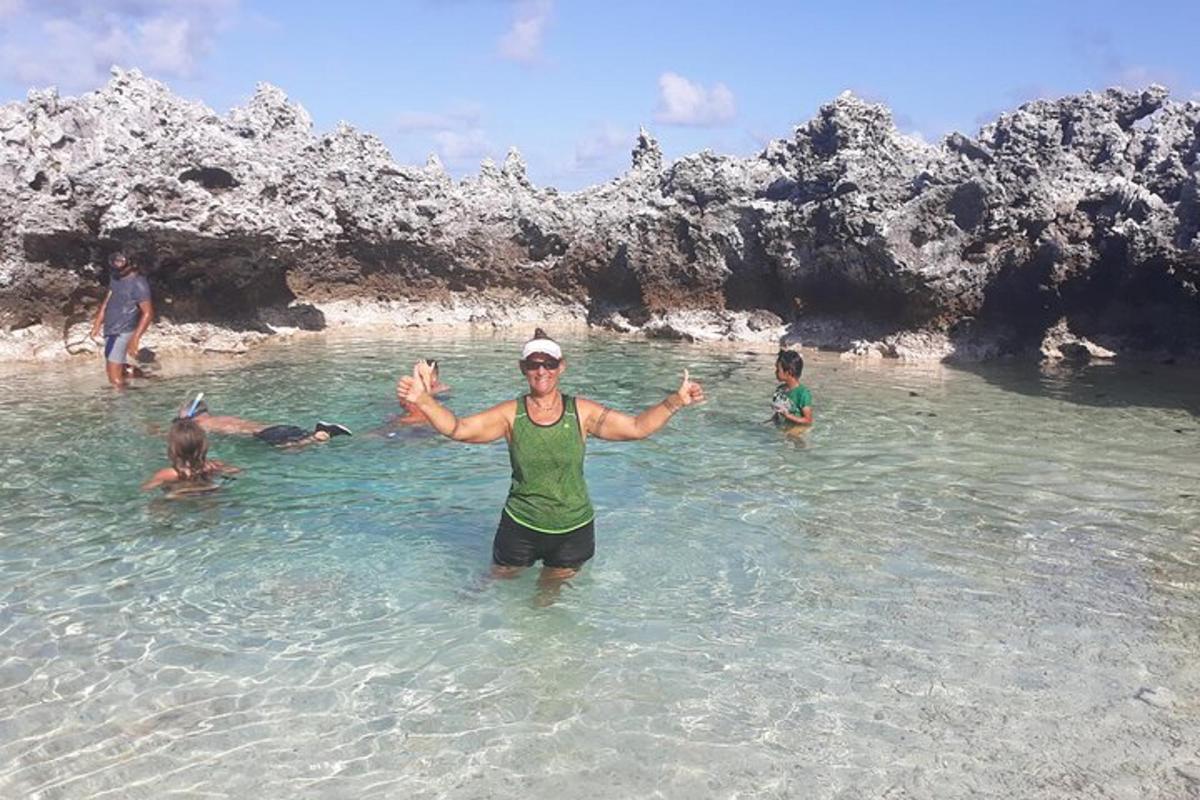 a man standing in the water at a beach