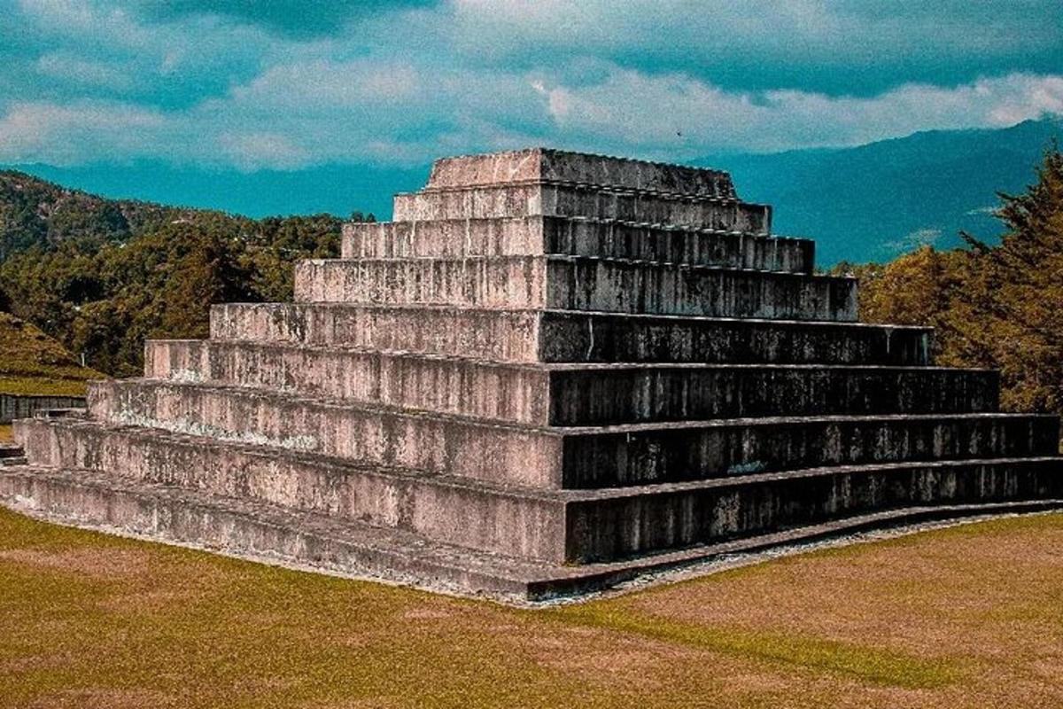 a large stone structure sitting on top of a field