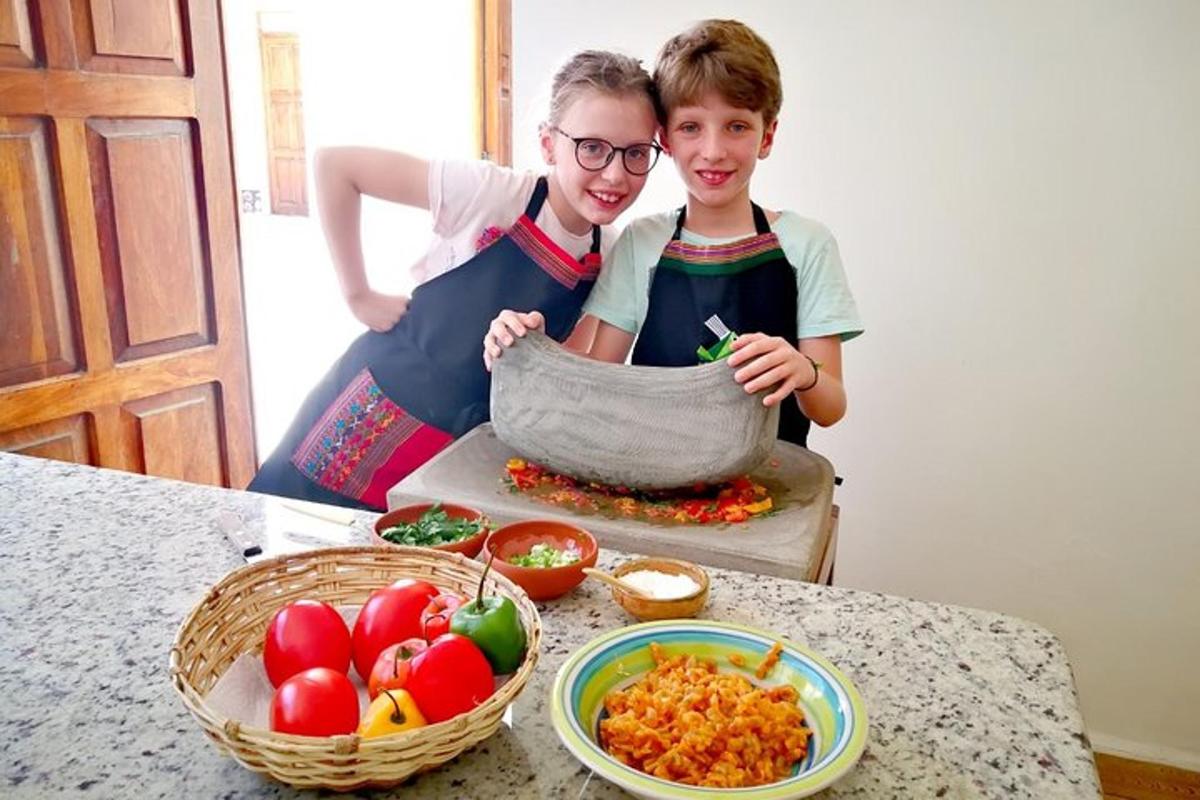 a woman and a boy making a bowl of food