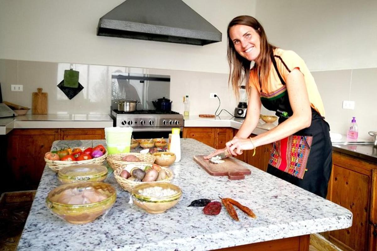 a woman standing in a kitchen preparing food