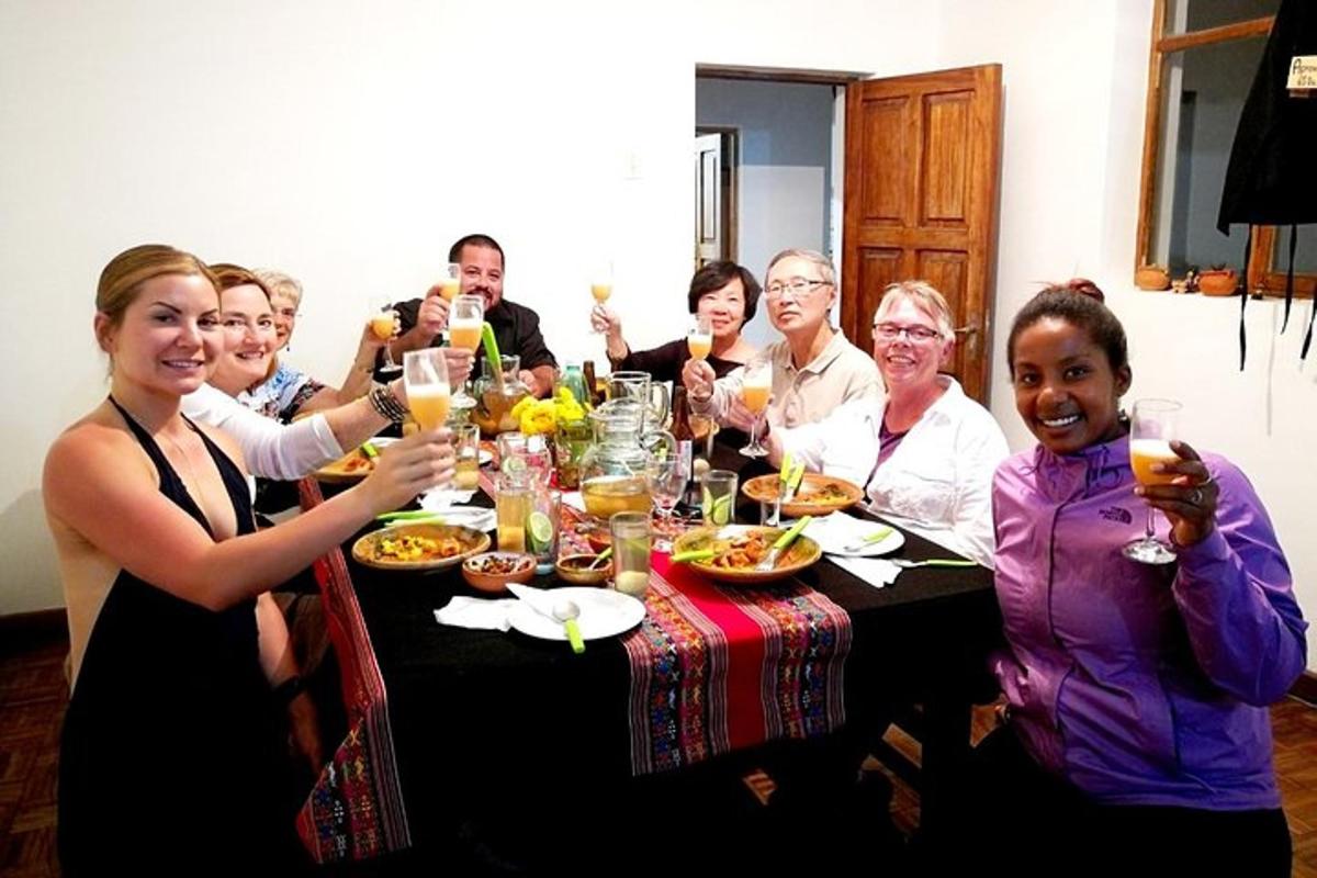 a group of people sitting at a table drinking champagne