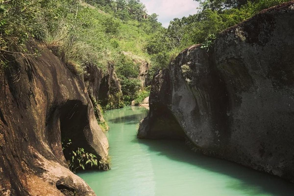 a river with green water between two large rocks