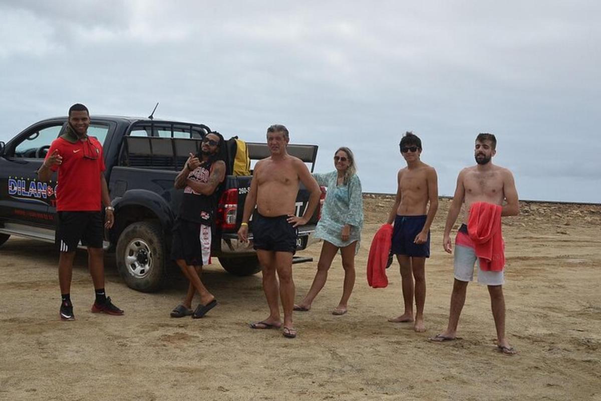 a group of people standing in front of a truck