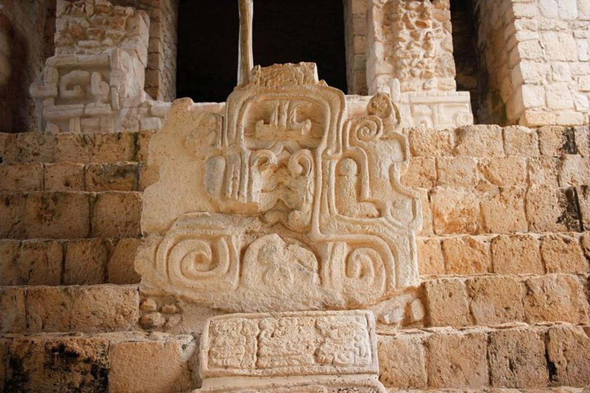 a stone building with a carving on the side of it
