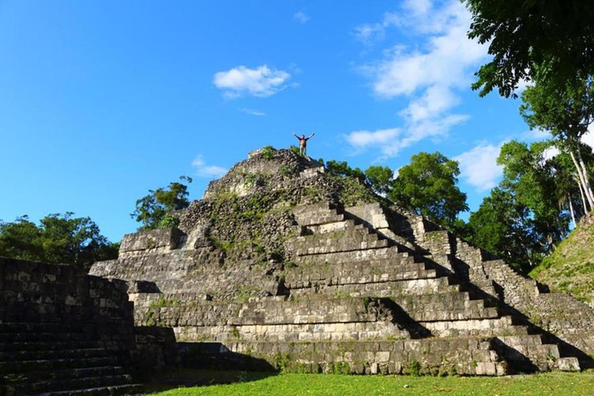 a man standing on top of a pyramid