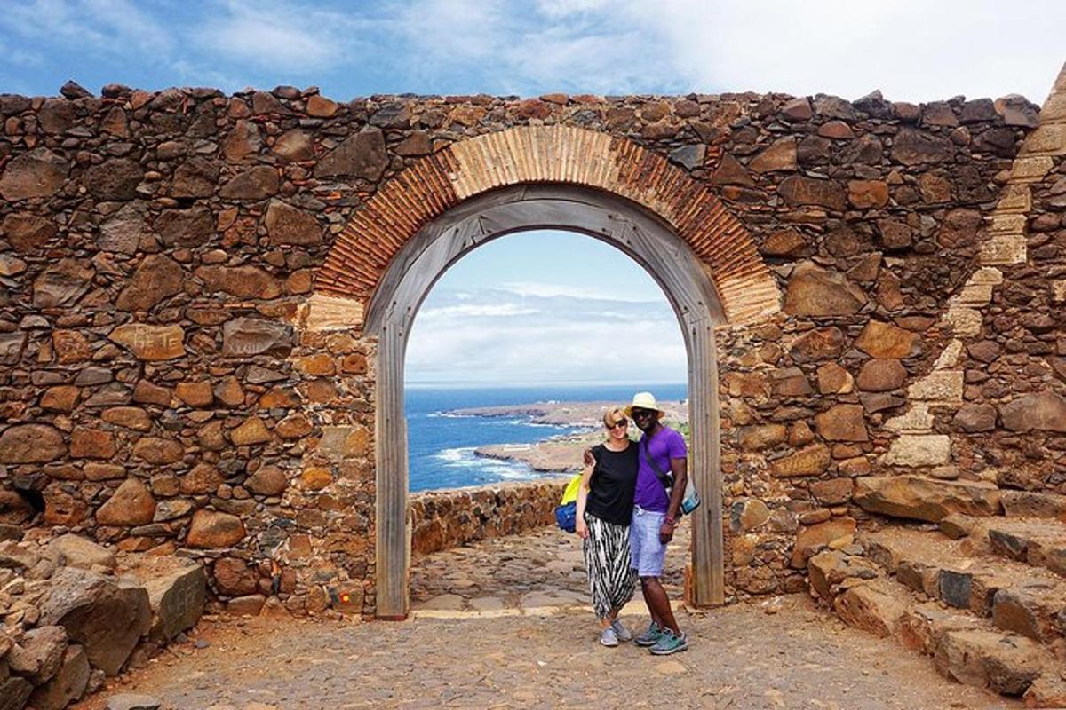 a man and a woman standing in an archway