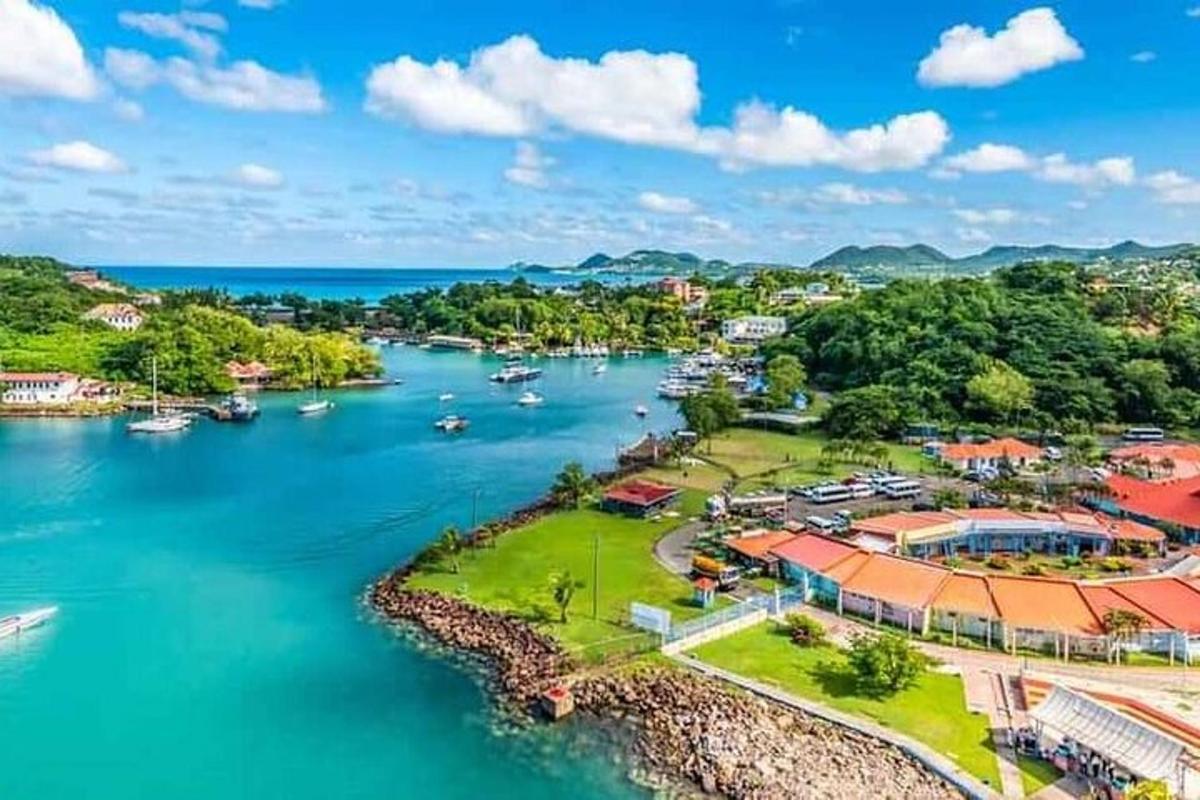 an aerial view of a town next to a river