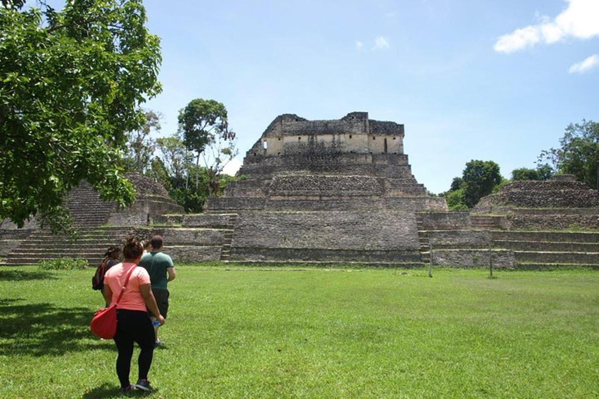 a group of people standing in front of ruins