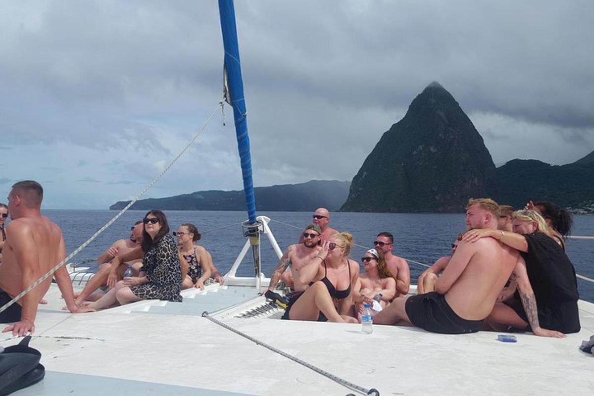 a group of people sitting on a boat in the water