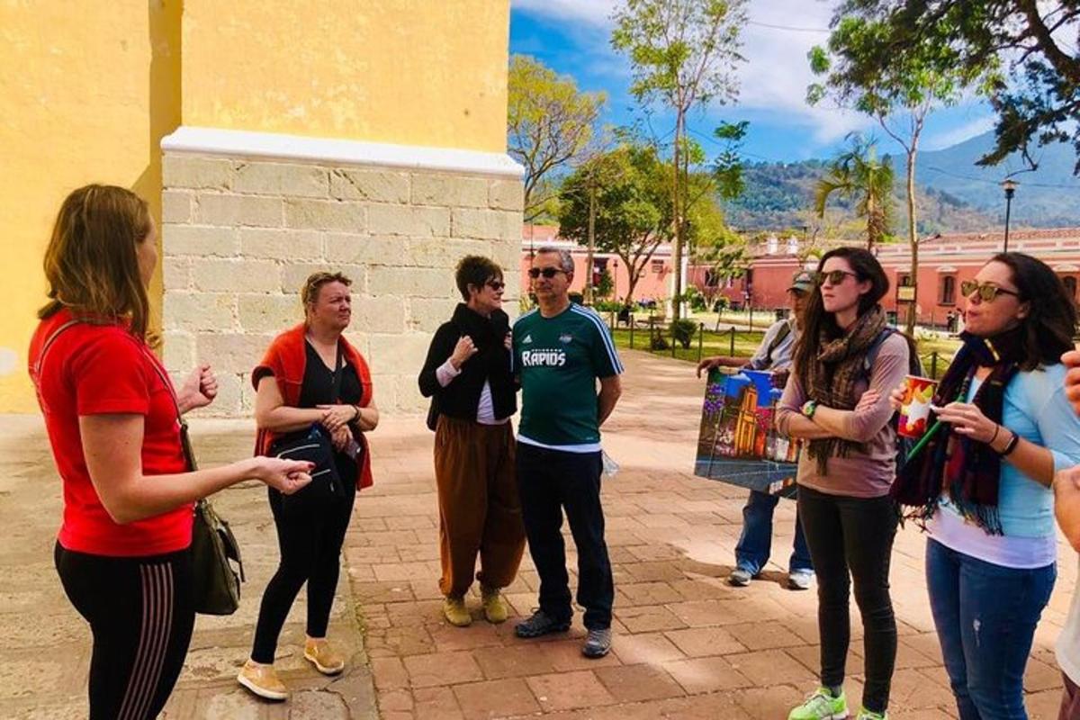 a group of people standing next to a building