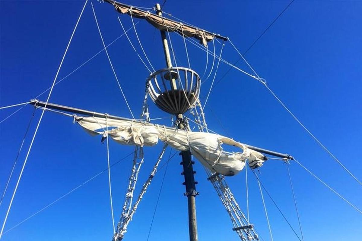 a mast of a boat with a net on it