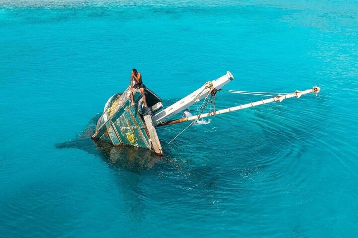 a person standing on a boat in the water