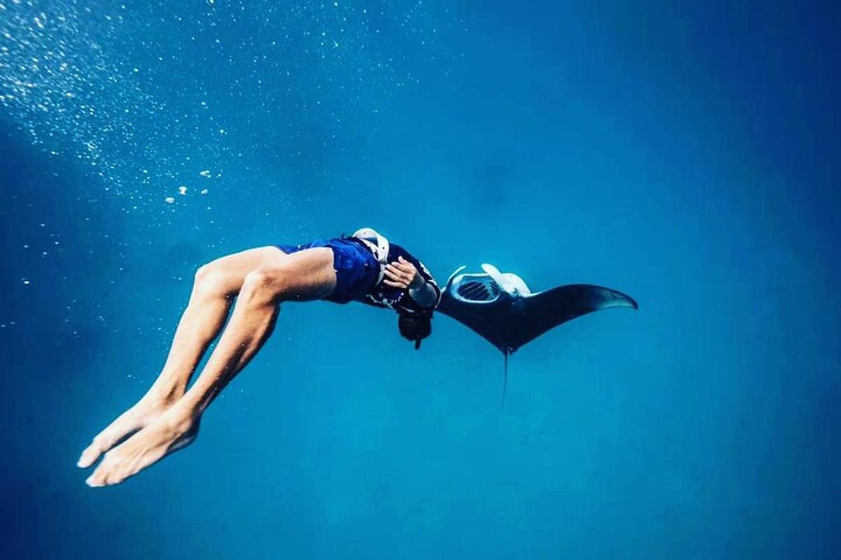 a man floating in the water with aqual